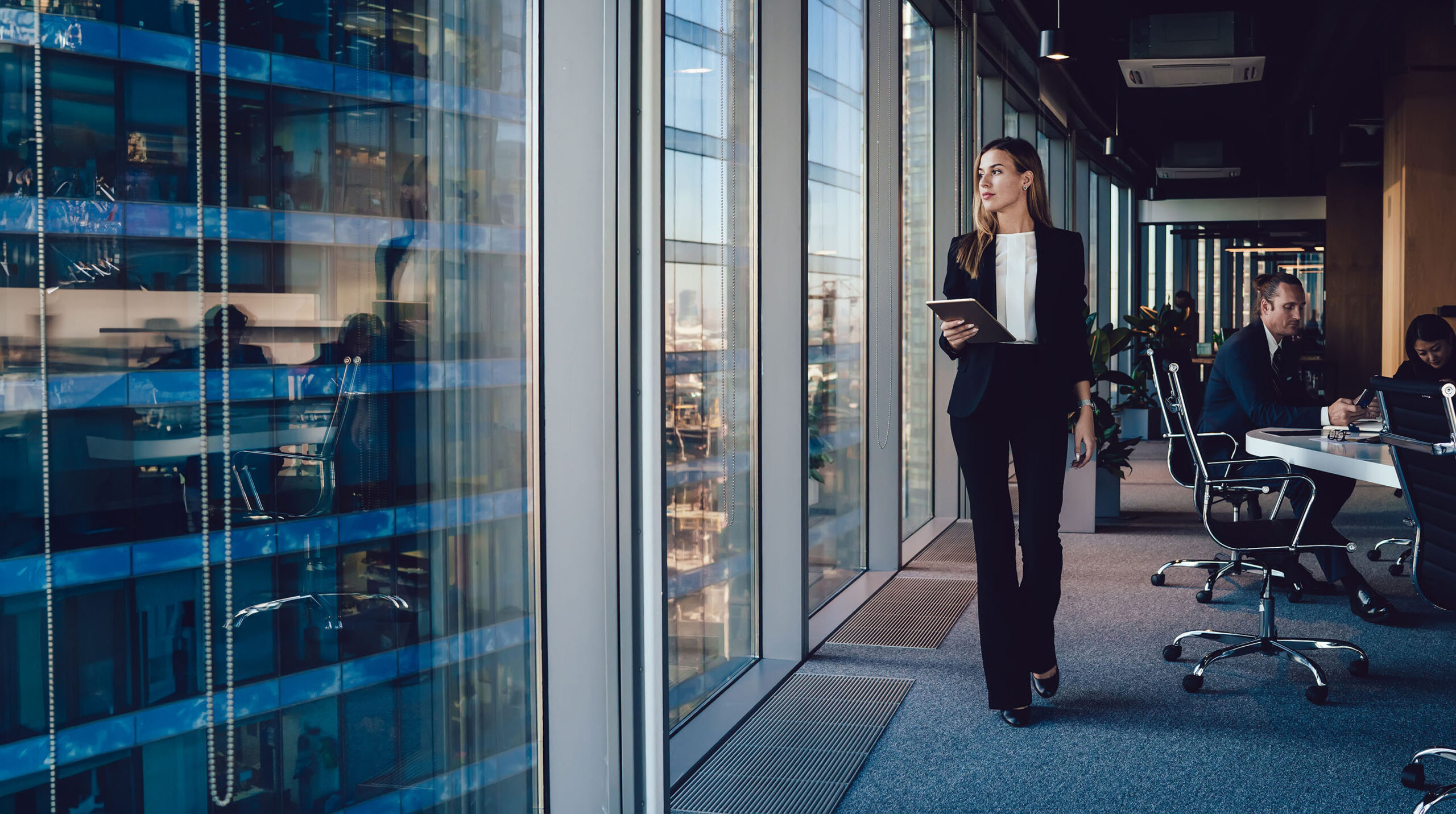 Professional walking through a modern office
